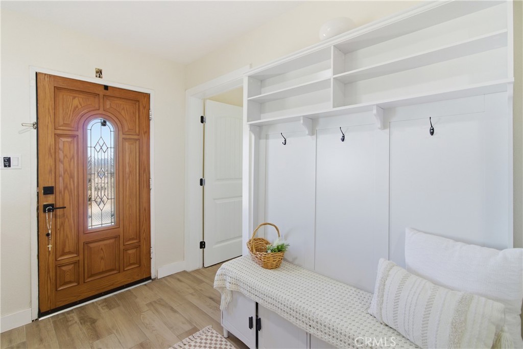 3552 Condalia Avenue Yucca Valley, CA 92284 - Photo 3 of 30 a bedroom with a bed and a chandelier