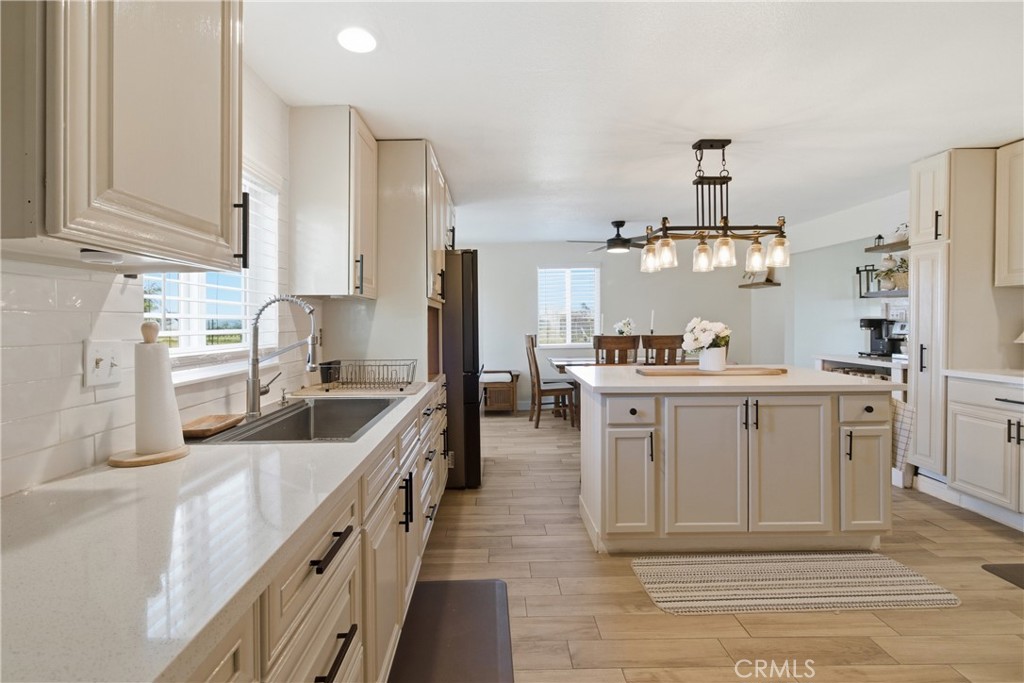 3552 Condalia Avenue Yucca Valley, CA 92284 - Photo 10 of 30 a kitchen with white cabinets and appliances