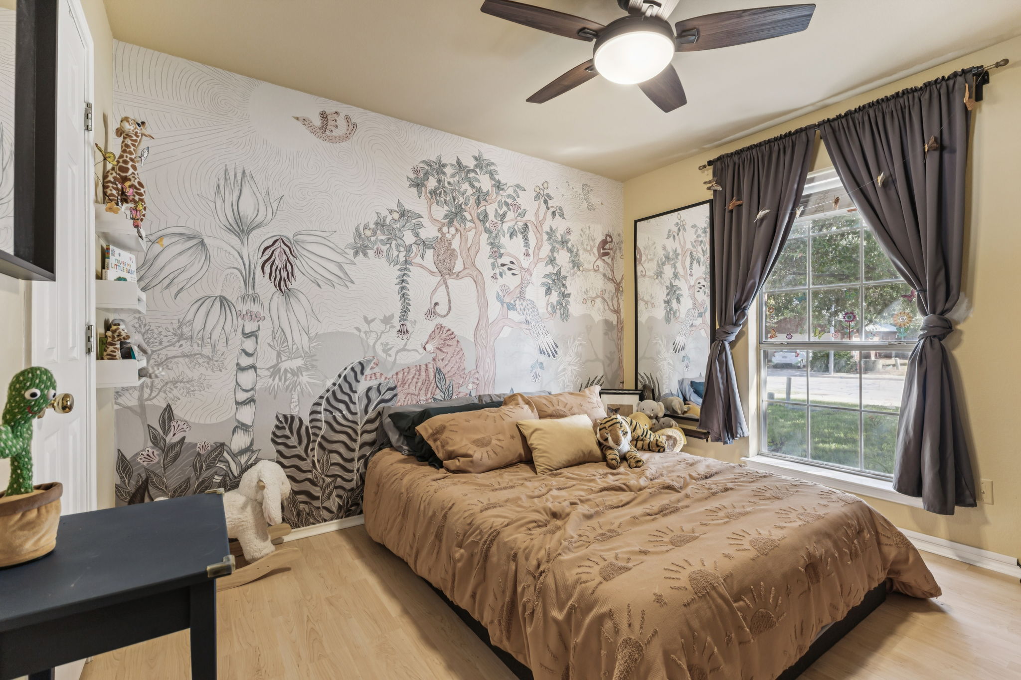 2412 Chestnut Path Round Rock, TX 78664 - Photo 14 of 26 A cheerful bedroom with vibrant wall art and a large window offers a serene personal retreat.