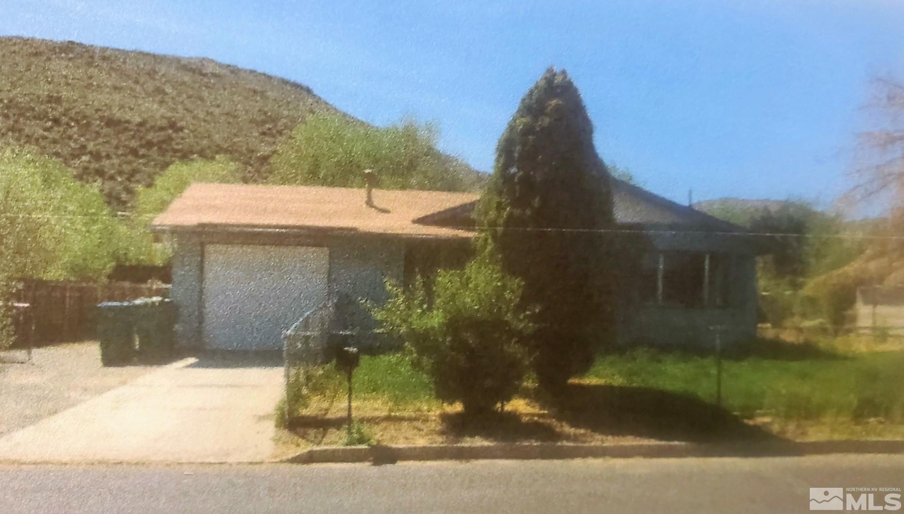 9490 Fremont Way Reno, NV 89506 - Photo 1 of 1 a front view of a house with a yard
