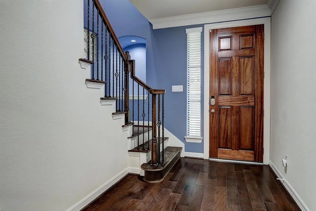 5505 Zoemark Lane Houston, TX 77021 - Photo 3 of 9 a view of front door with wooden floor and stairs