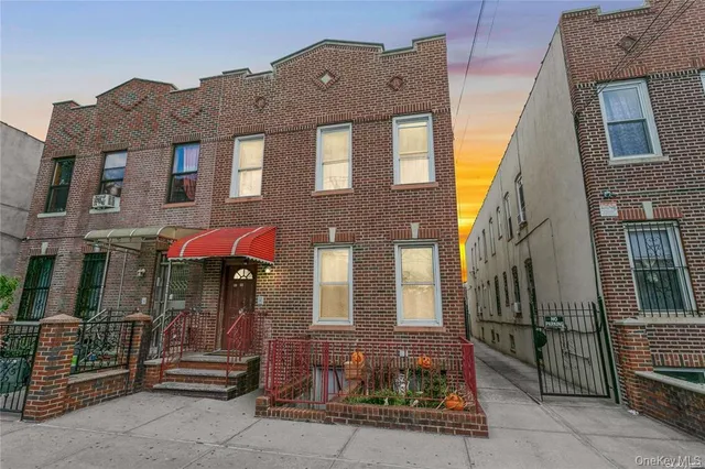 a front view of a building with retail shops