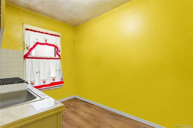 a room with a bed and a potted plant