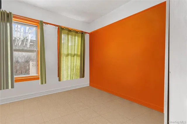 a view of an empty room with windows