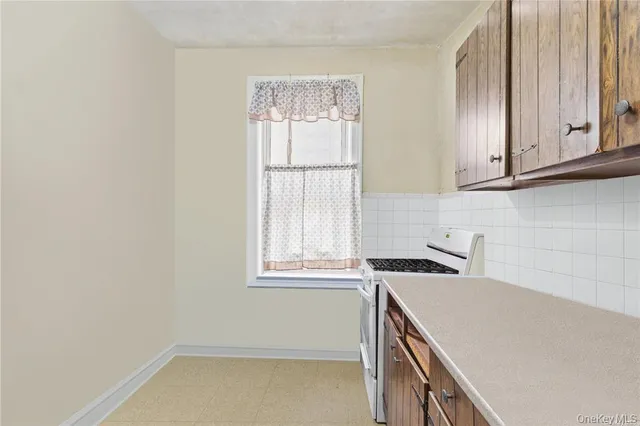 a view of a kitchen with a sink cabinets and a window