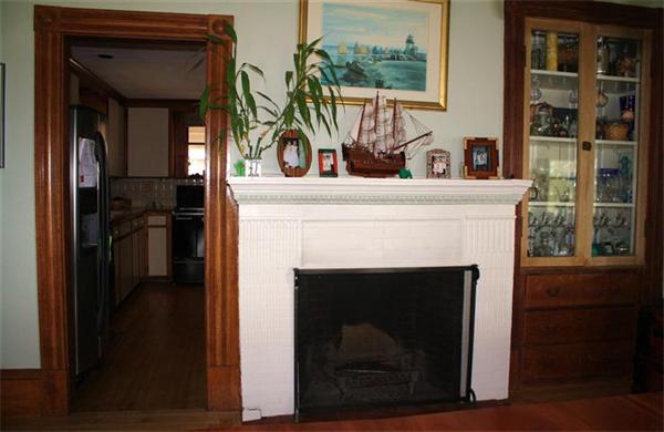 8 Summit Avenue Hull, MA 02045 - Photo 13 of 30 a living room with a fireplace and a window