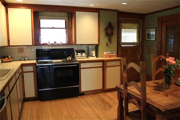 8 Summit Avenue Hull, MA 02045 - Photo 14 of 30 a kitchen with a stove a sink and a microwave