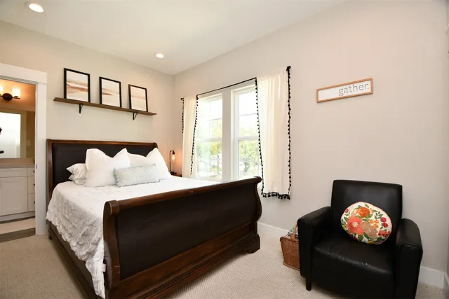 a bedroom with a bed and a couch