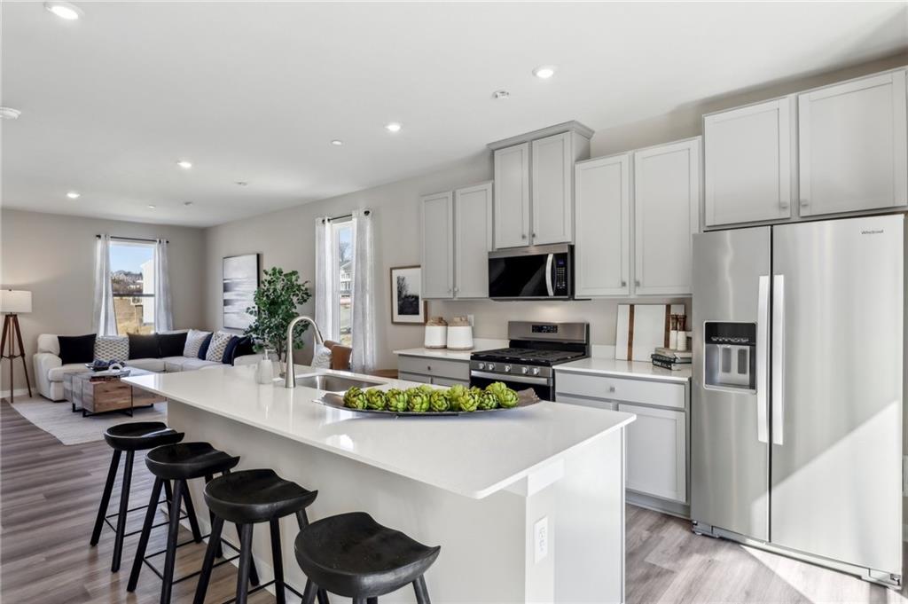 136 River Ridge Drive Coraopolis, PA 15108 - Photo 13 of 28 a kitchen with white cabinets and stainless steel appliances