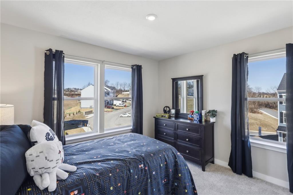 136 River Ridge Drive Coraopolis, PA 15108 - Photo 19 of 28 a bedroom with a bed and large windows