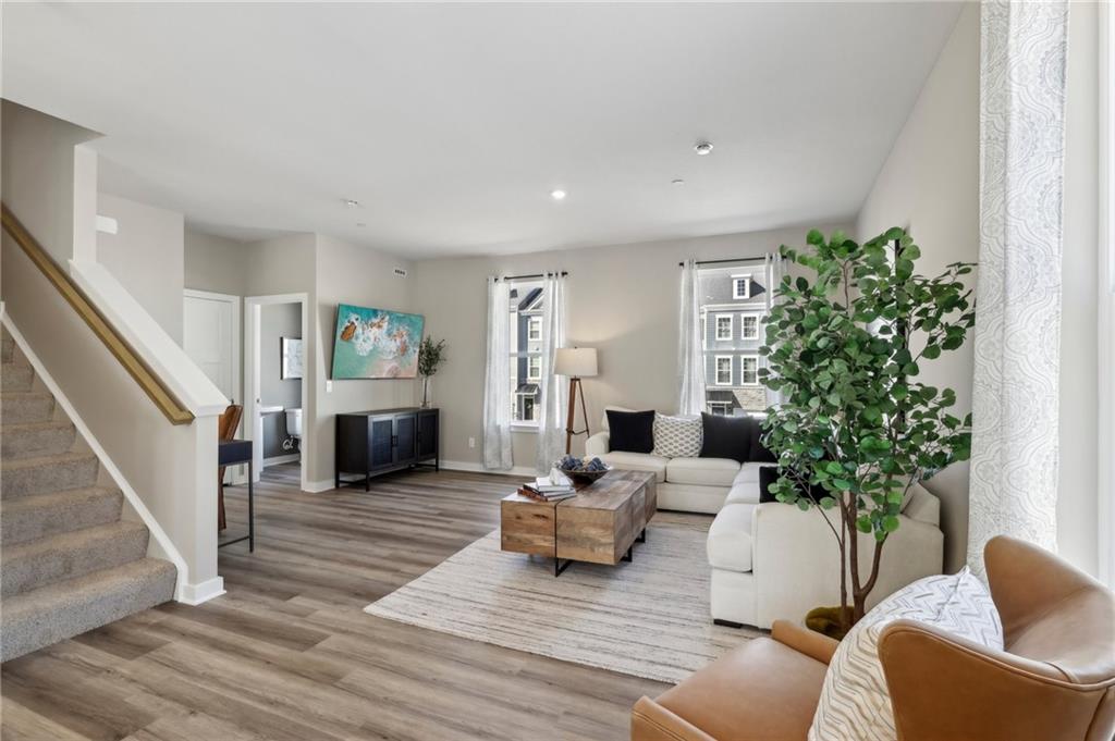 136 River Ridge Drive Coraopolis, PA 15108 - Photo 7 of 28 a living room with furniture a potted plant and a fireplace