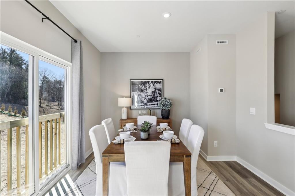 136 River Ridge Drive Coraopolis, PA 15108 - Photo 10 of 28 a view of a dining room with furniture a chandelier and wooden floor