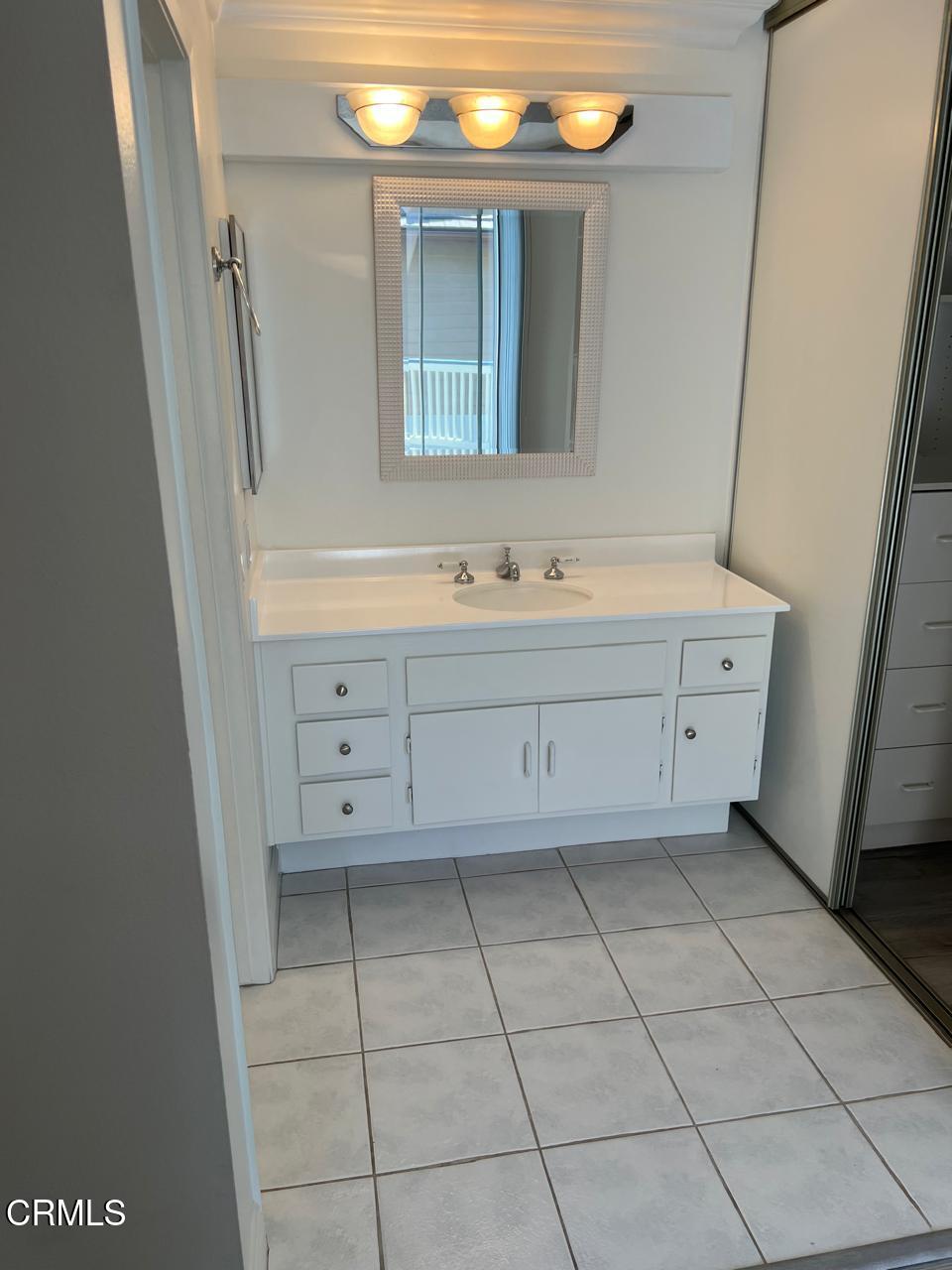 2394 Pleasant Way, Unit J Thousand Oaks, CA 91362 - Photo 12 of 12 a bathroom with a bathtub sink and mirror