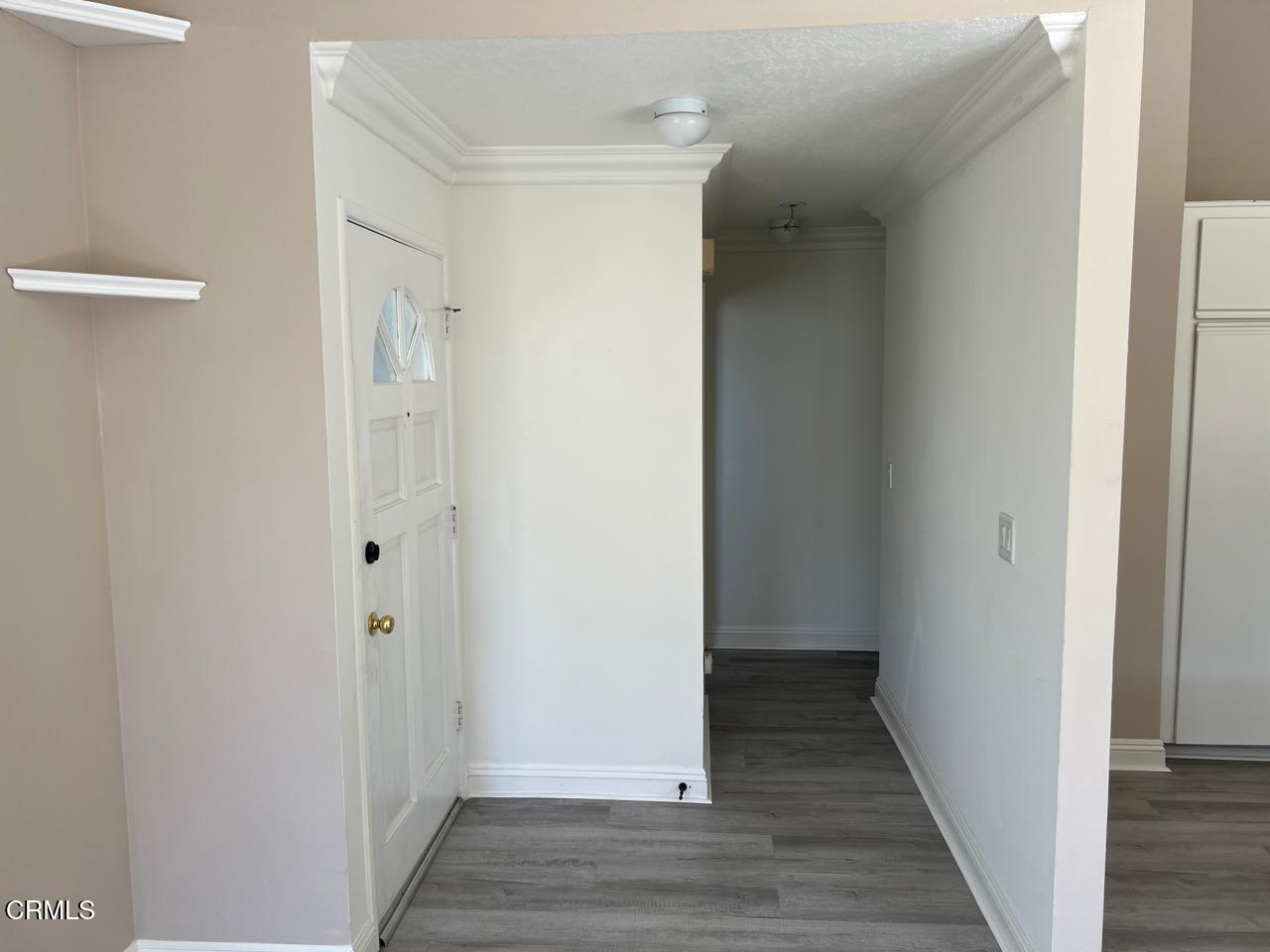 2394 Pleasant Way, Unit J Thousand Oaks, CA 91362 - Photo 2 of 12 a view of a hallway with wooden floor