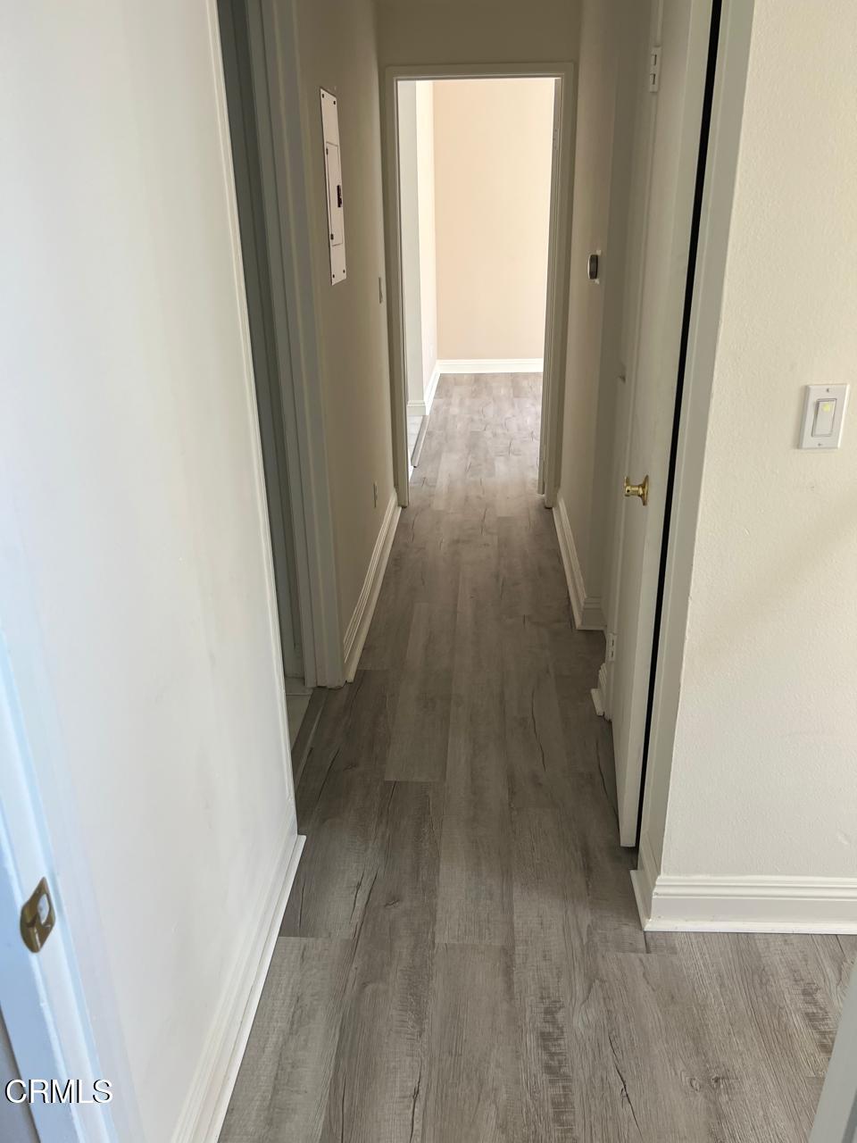 2394 Pleasant Way, Unit J Thousand Oaks, CA 91362 - Photo 6 of 12 a view of a hallway and wooden floor