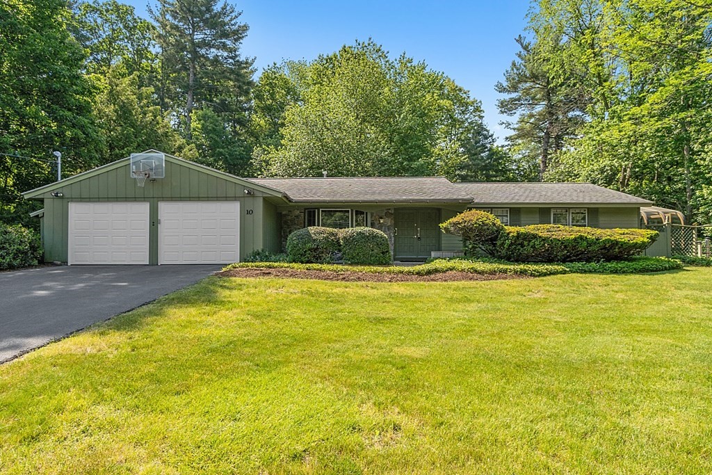 10 Bonanza Road Chelmsford, MA 01824 - Photo 1 of 41 a house view with swimming pool and trees in the background