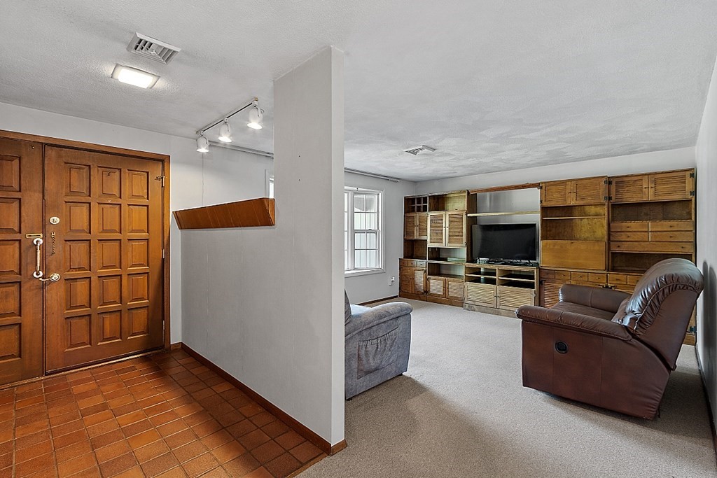 10 Bonanza Road Chelmsford, MA 01824 - Photo 13 of 41 a living room with furniture and a flat screen tv