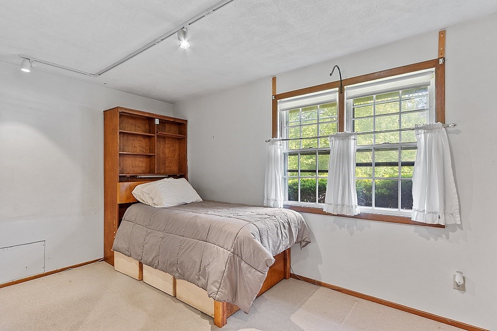 10 Bonanza Road Chelmsford, MA 01824 - Photo 17 of 41 a bedroom with a bed and a large window