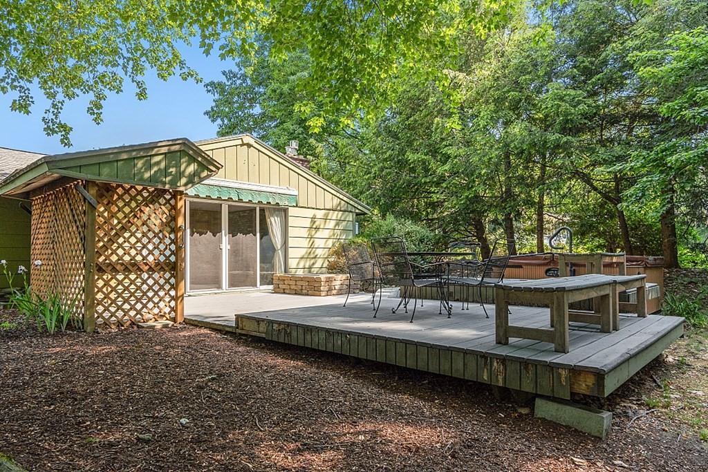 10 Bonanza Road Chelmsford, MA 01824 - Photo 31 of 41 a backyard of a house with wooden floor and fence