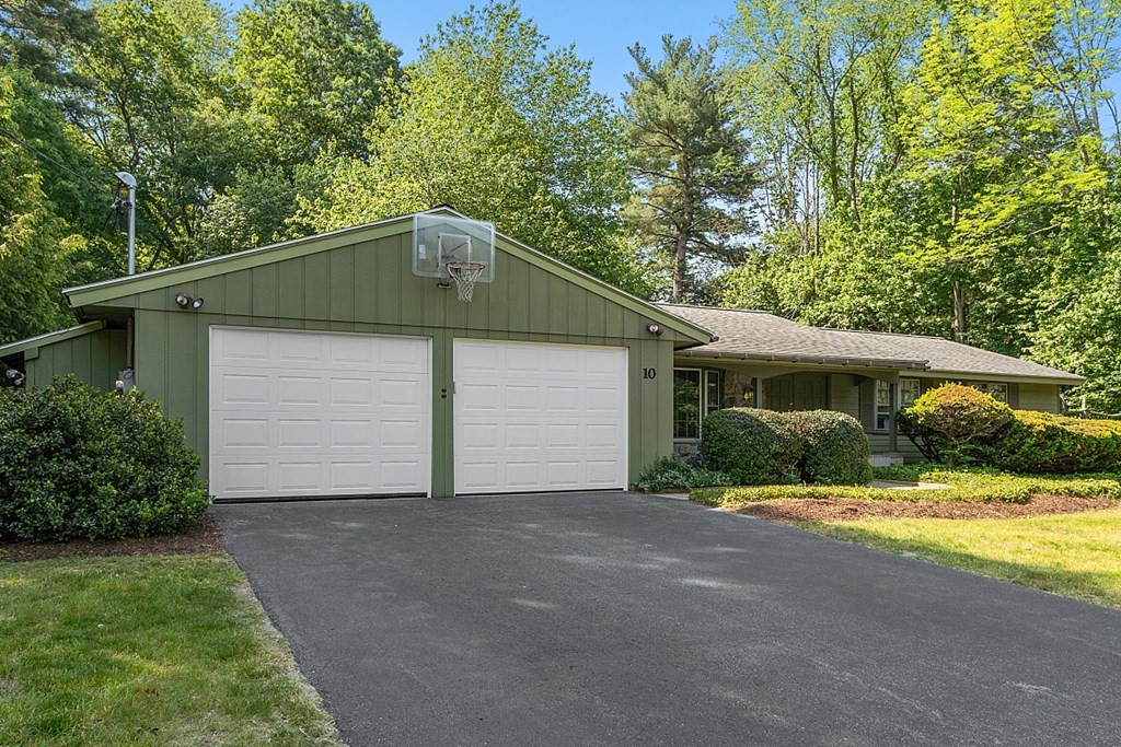10 Bonanza Road Chelmsford, MA 01824 - Photo 41 of 41 a front view of a house with a yard and garage