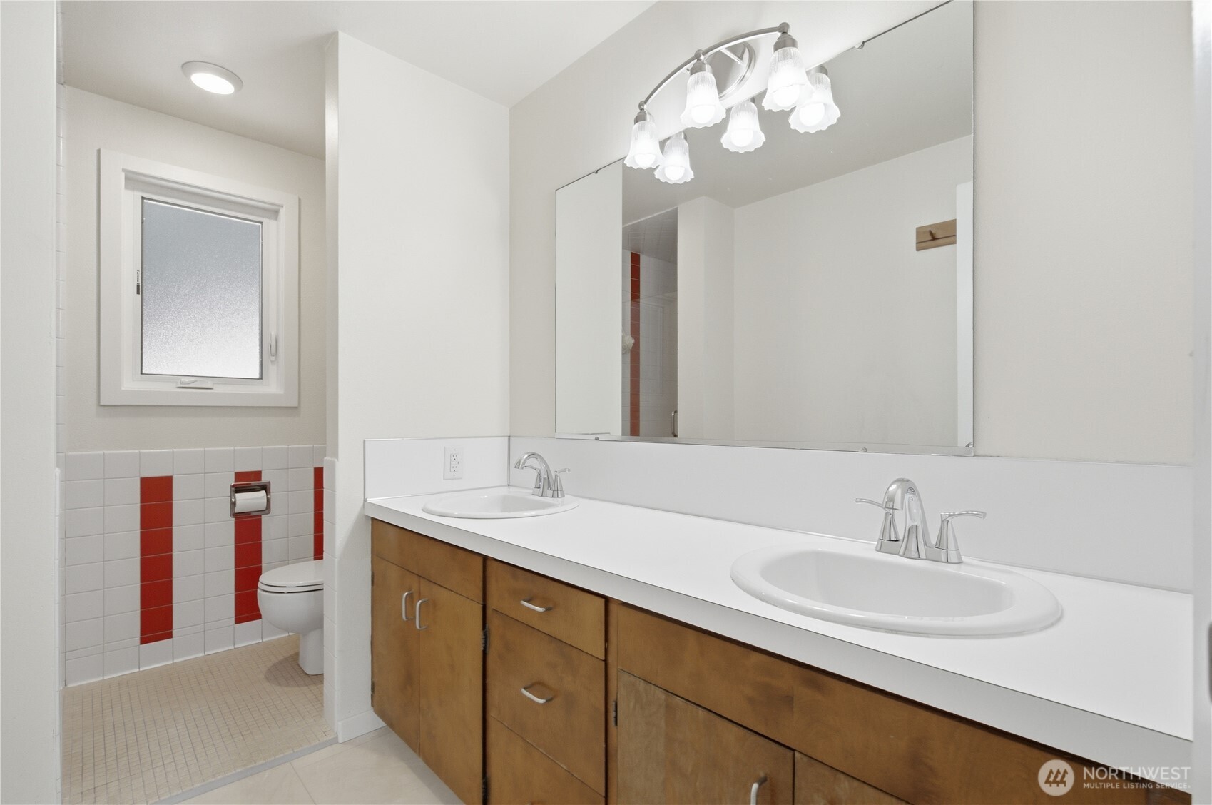 3050 Southeast Mullenix Road Port Orchard, WA 98367 - Photo 15 of 40 a bathroom with a sink double vanity and a mirror