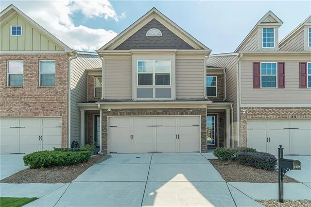 a front view of a house with a garage