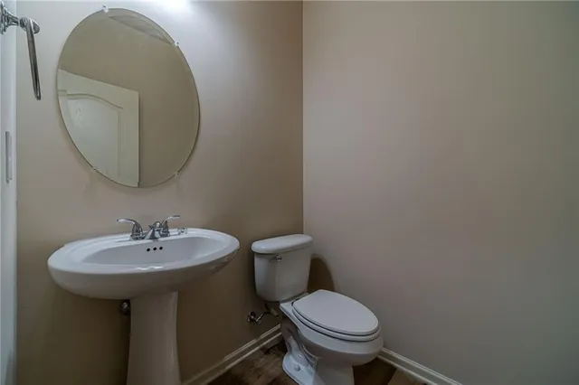 a large kitchen with stainless steel appliances granite countertop a stove a sink dishwasher and a large refrigerator