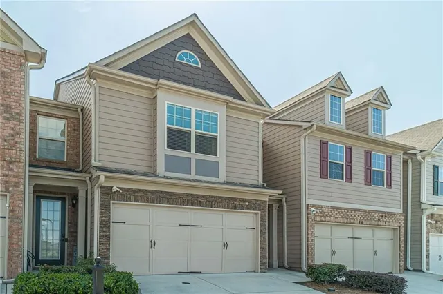 a view of a house with a window and brick walls