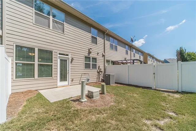 a house with lots of trees in the background