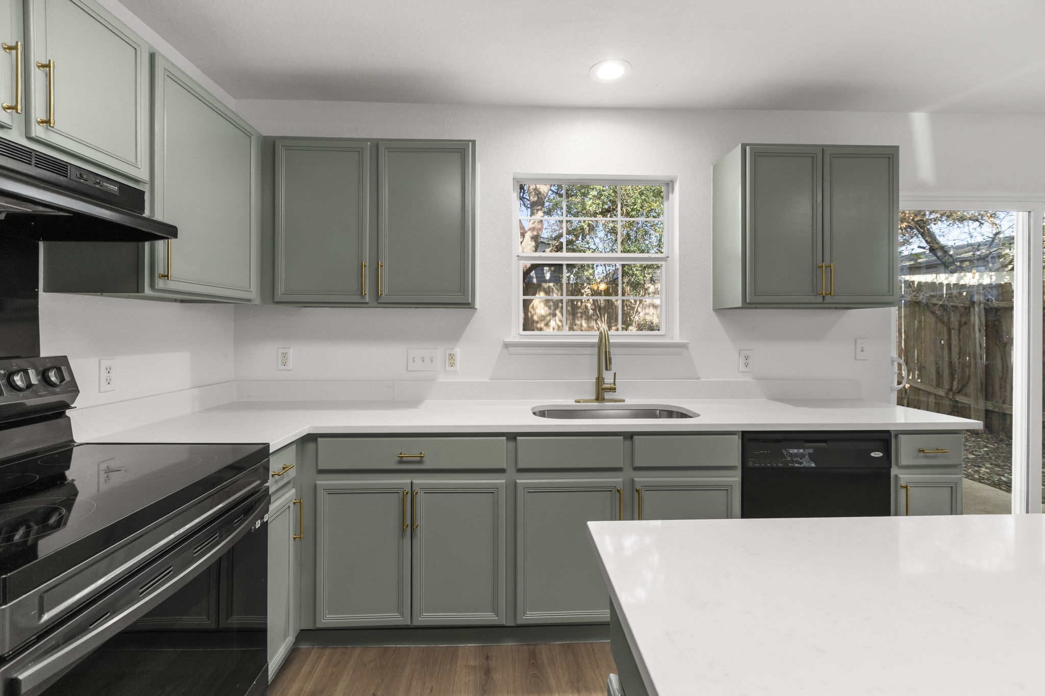 2110 Nogales Trail Austin, TX 78744 - Photo 17 of 37 a kitchen with a sink stove and cabinets