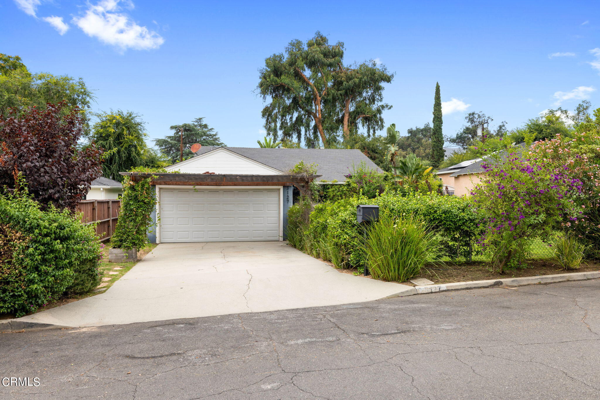 3127 Thurin Avenue Altadena, CA 91001 - Photo 2 of 23 a front view of a house with a yard and trees