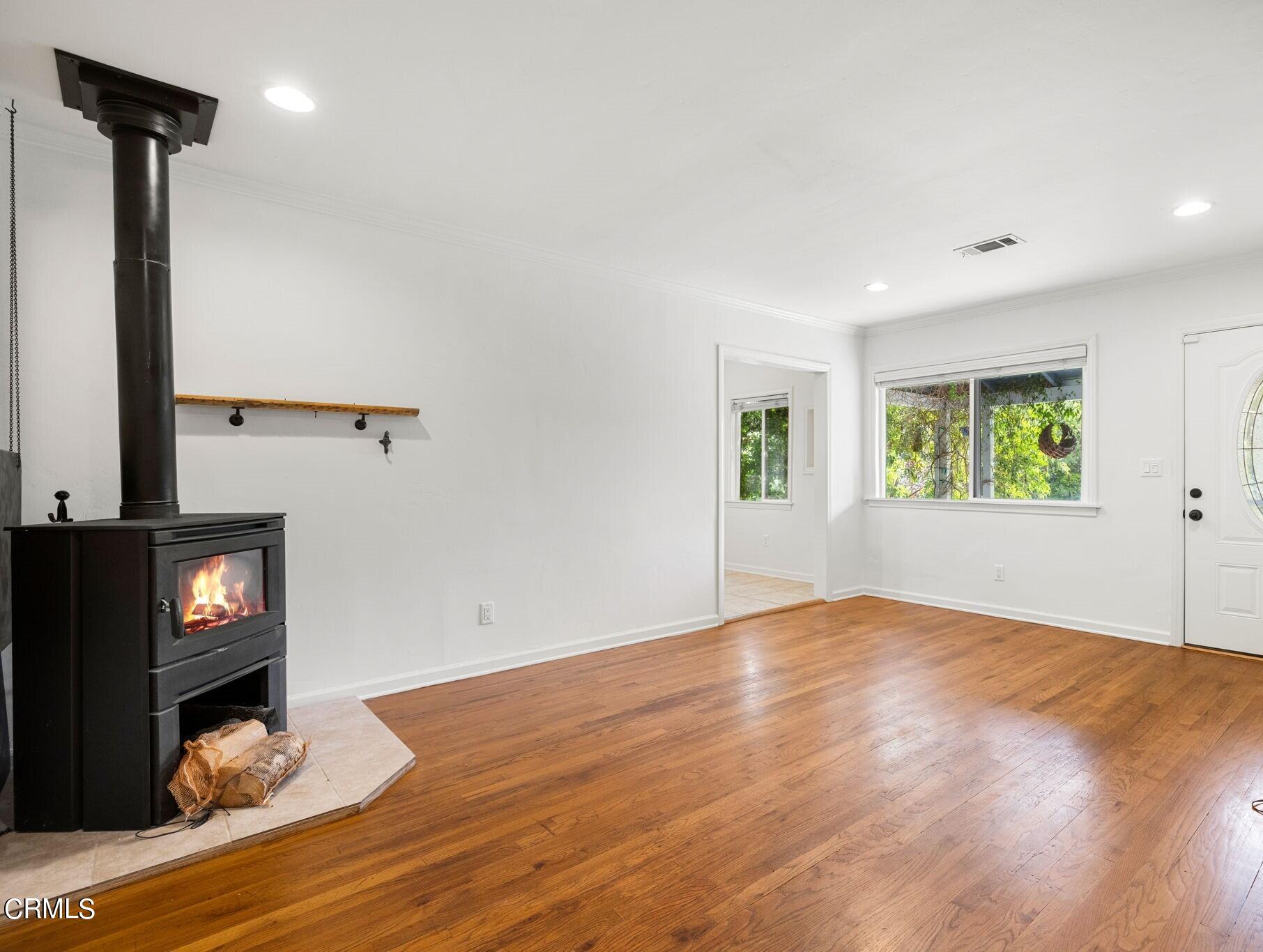 3127 Thurin Avenue Altadena, CA 91001 - Photo 4 of 23 a view of an empty room with wooden floor and a window