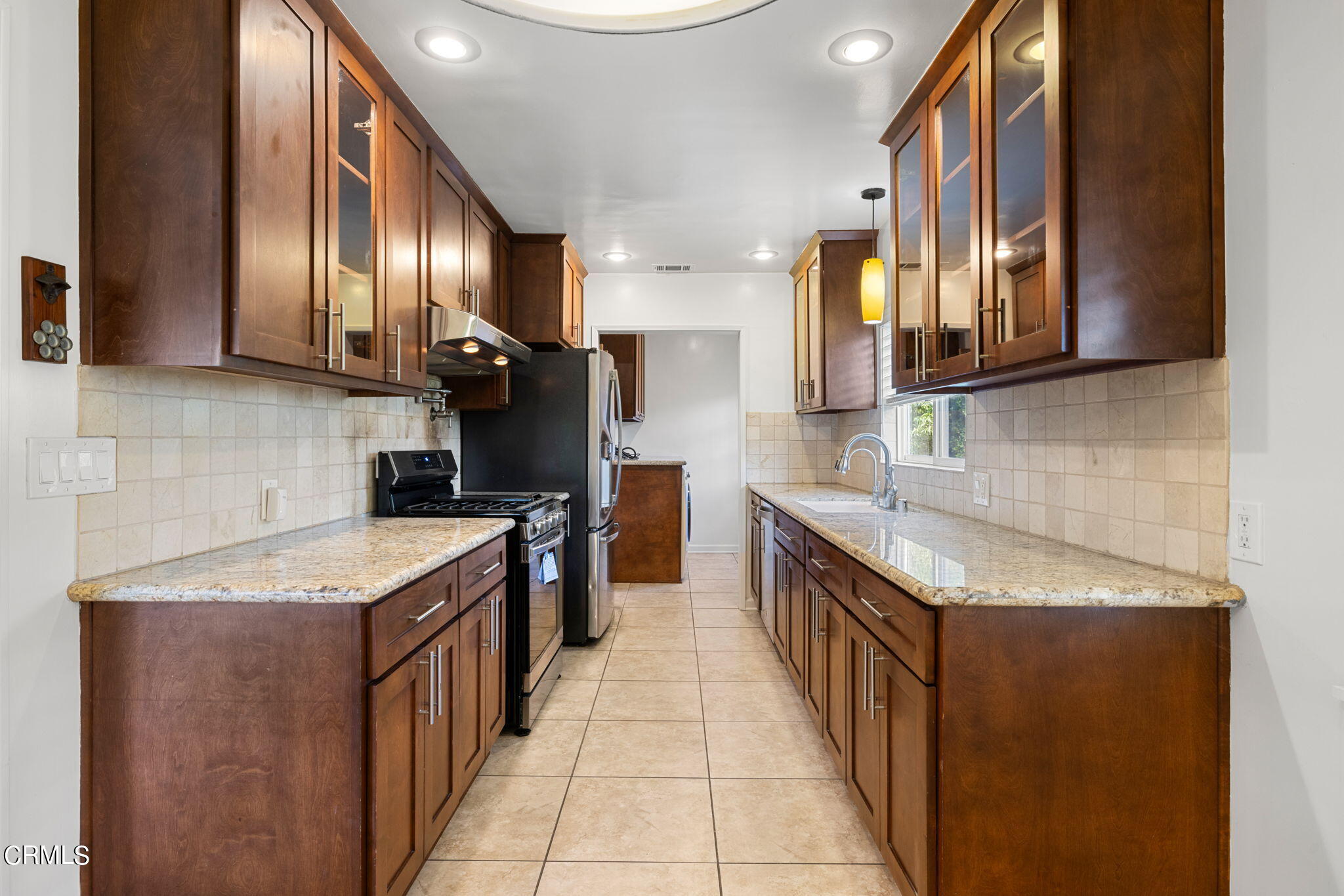 3127 Thurin Avenue Altadena, CA 91001 - Photo 6 of 23 a kitchen with stainless steel appliances granite countertop a sink and a stove