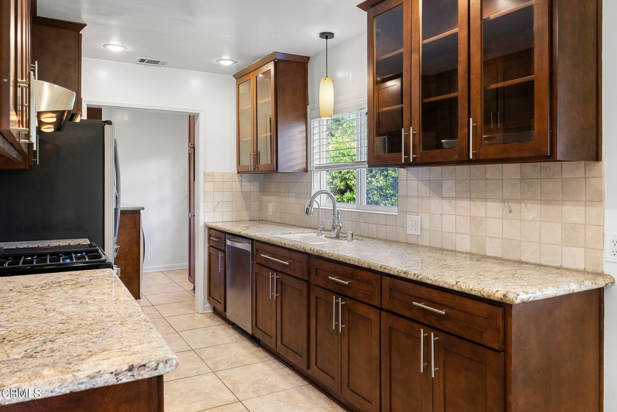 3127 Thurin Avenue Altadena, CA 91001 - Photo 7 of 23 a kitchen with stainless steel appliances granite countertop a sink stove and refrigerator