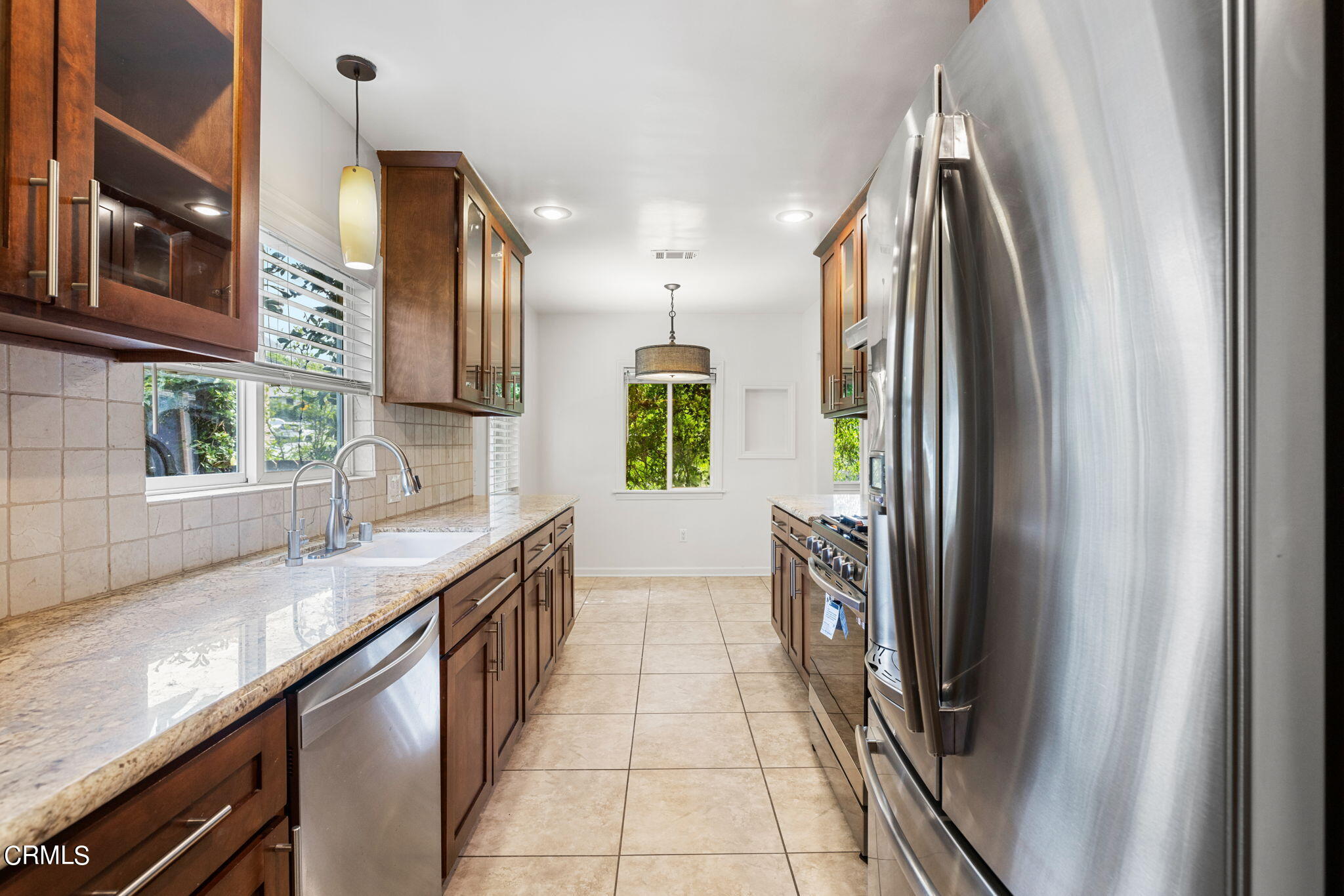 3127 Thurin Avenue Altadena, CA 91001 - Photo 9 of 23 a kitchen with stainless steel appliances granite countertop a refrigerator and a sink