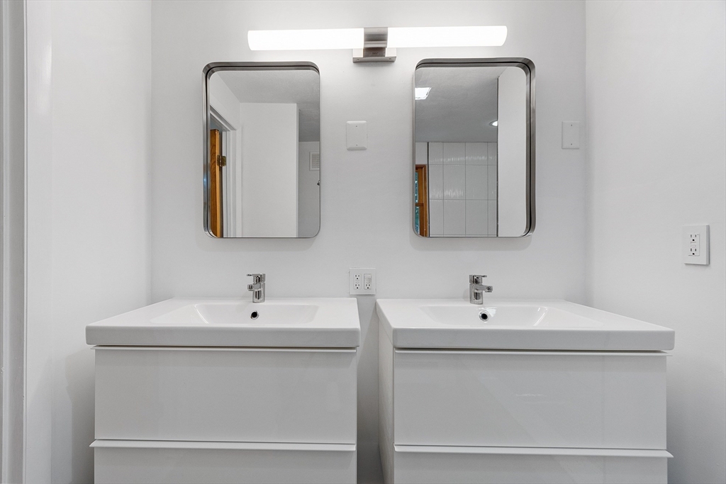 56 Old Littleton Road Harvard, MA 01451 - Photo 18 of 26 a bathroom with 2 sink and a mirror