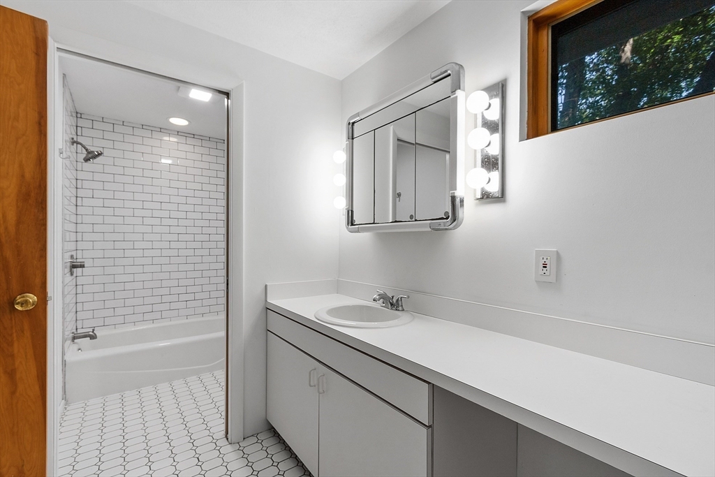 56 Old Littleton Road Harvard, MA 01451 - Photo 20 of 26 a bathroom with a sink and a mirror