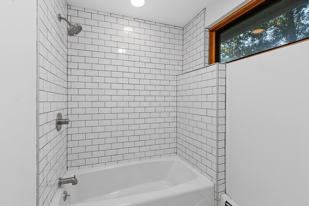 56 Old Littleton Road Harvard, MA 01451 - Photo 21 of 26 a bathroom with a bathtub