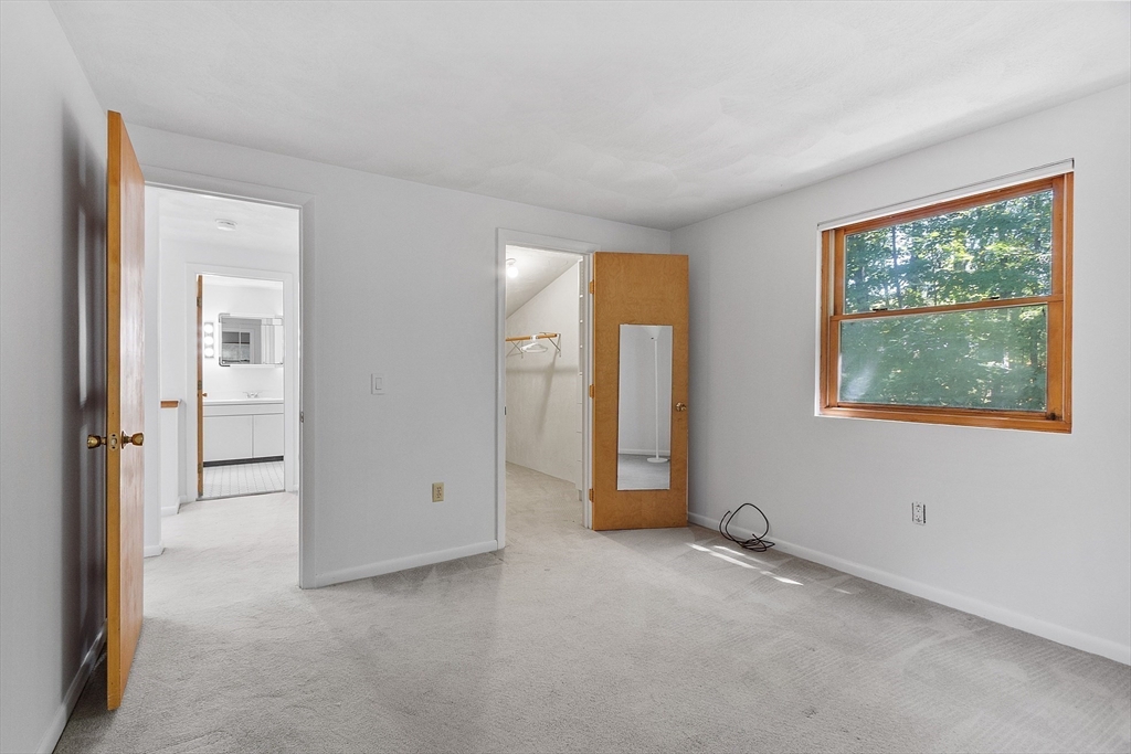 56 Old Littleton Road Harvard, MA 01451 - Photo 22 of 26 an empty room with windows and closet