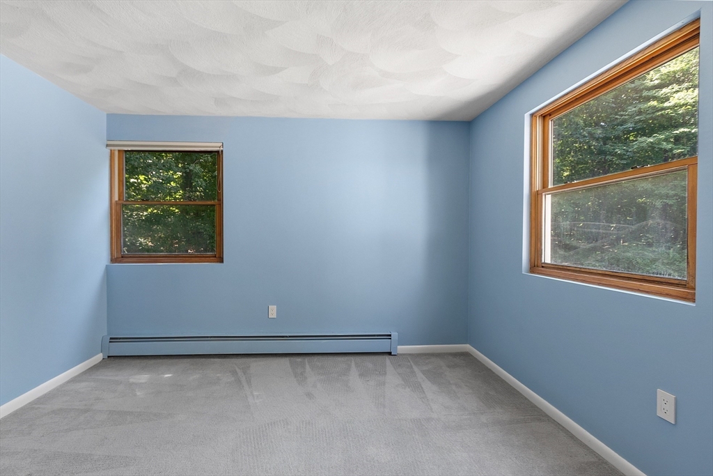 56 Old Littleton Road Harvard, MA 01451 - Photo 23 of 26 an empty room with a window
