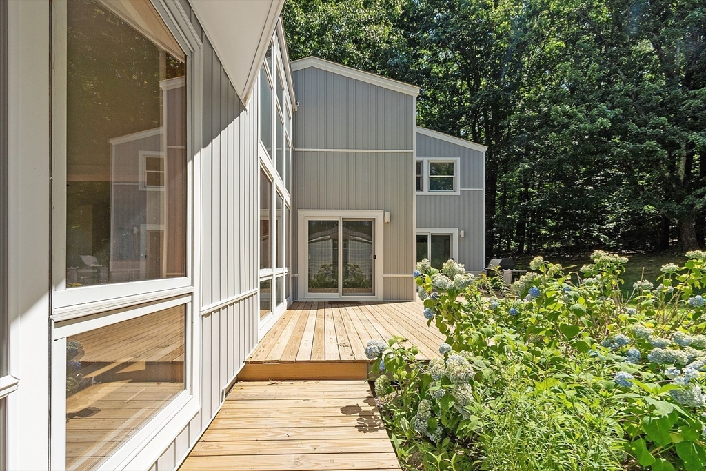 56 Old Littleton Road Harvard, MA 01451 - Photo 4 of 26 a view of a house with a small yard
