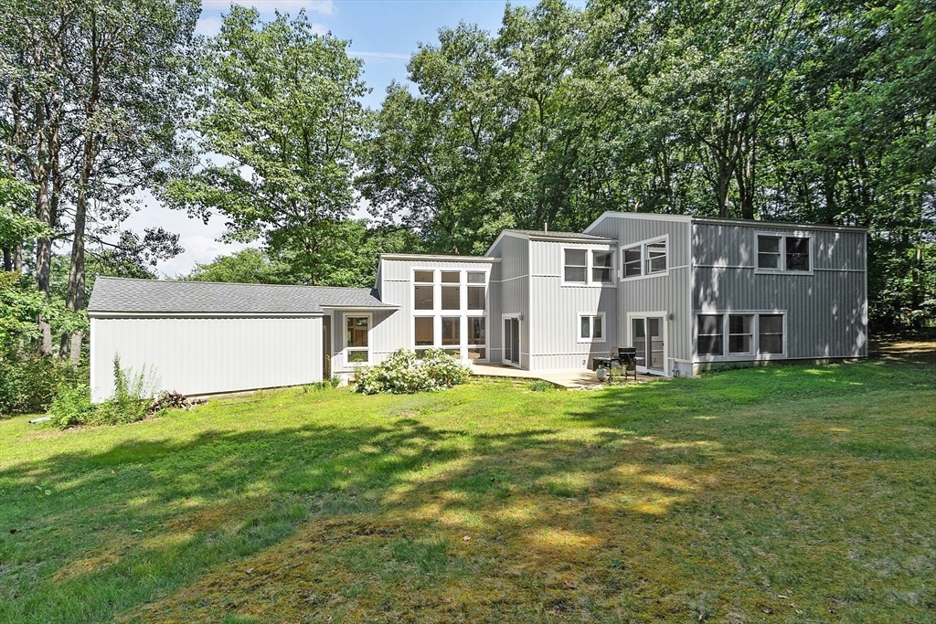 56 Old Littleton Road Harvard, MA 01451 - Photo 5 of 26 a house view with a sitting space and garden