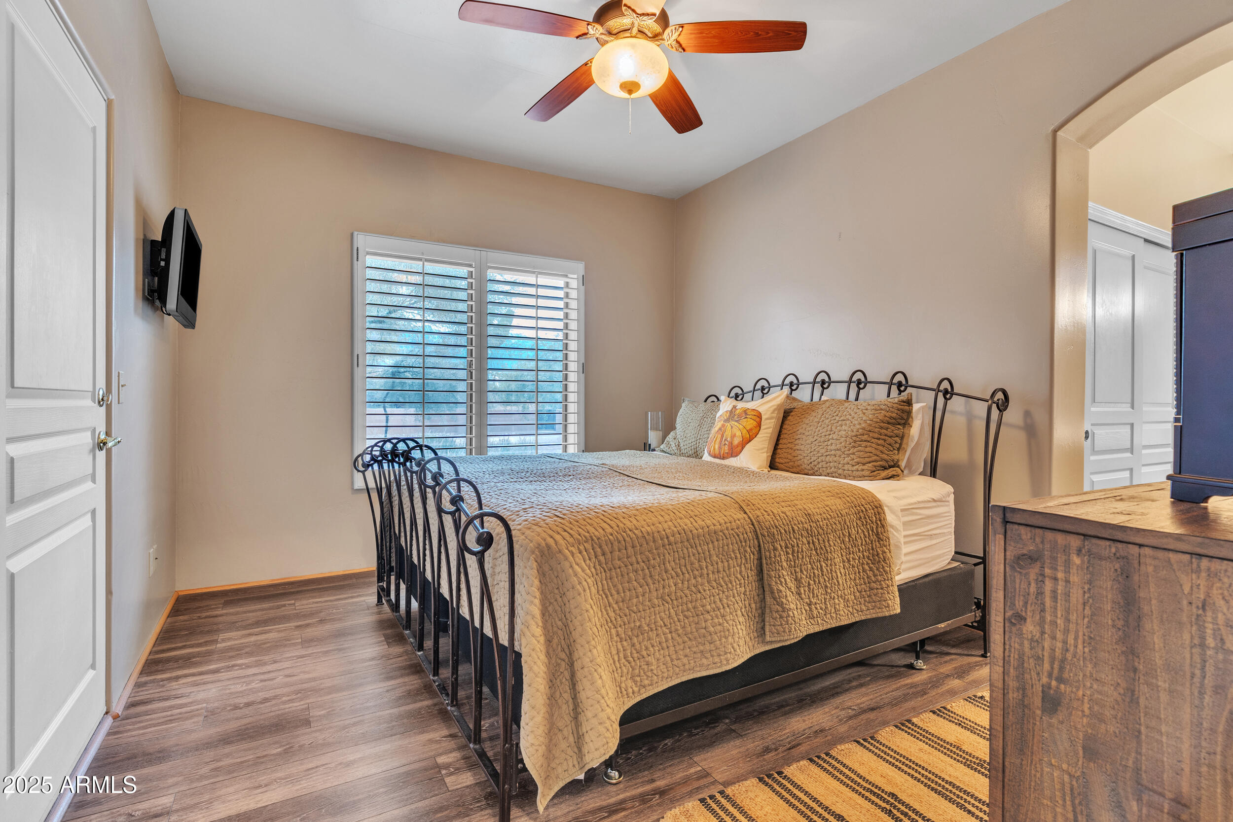 613 South Val Vista Road Apache Junction, AZ 85119 - Photo 14 of 31 a bedroom with bed and wooden floor