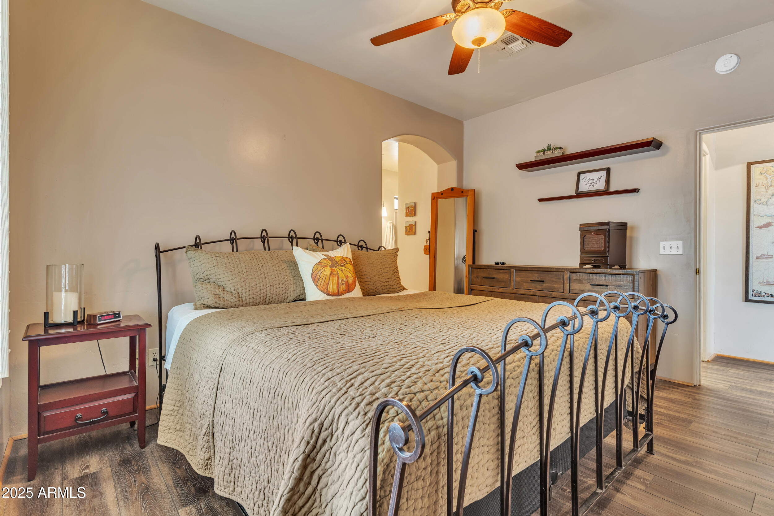 613 South Val Vista Road Apache Junction, AZ 85119 - Photo 15 of 31 a bed room with bed and a chandelier