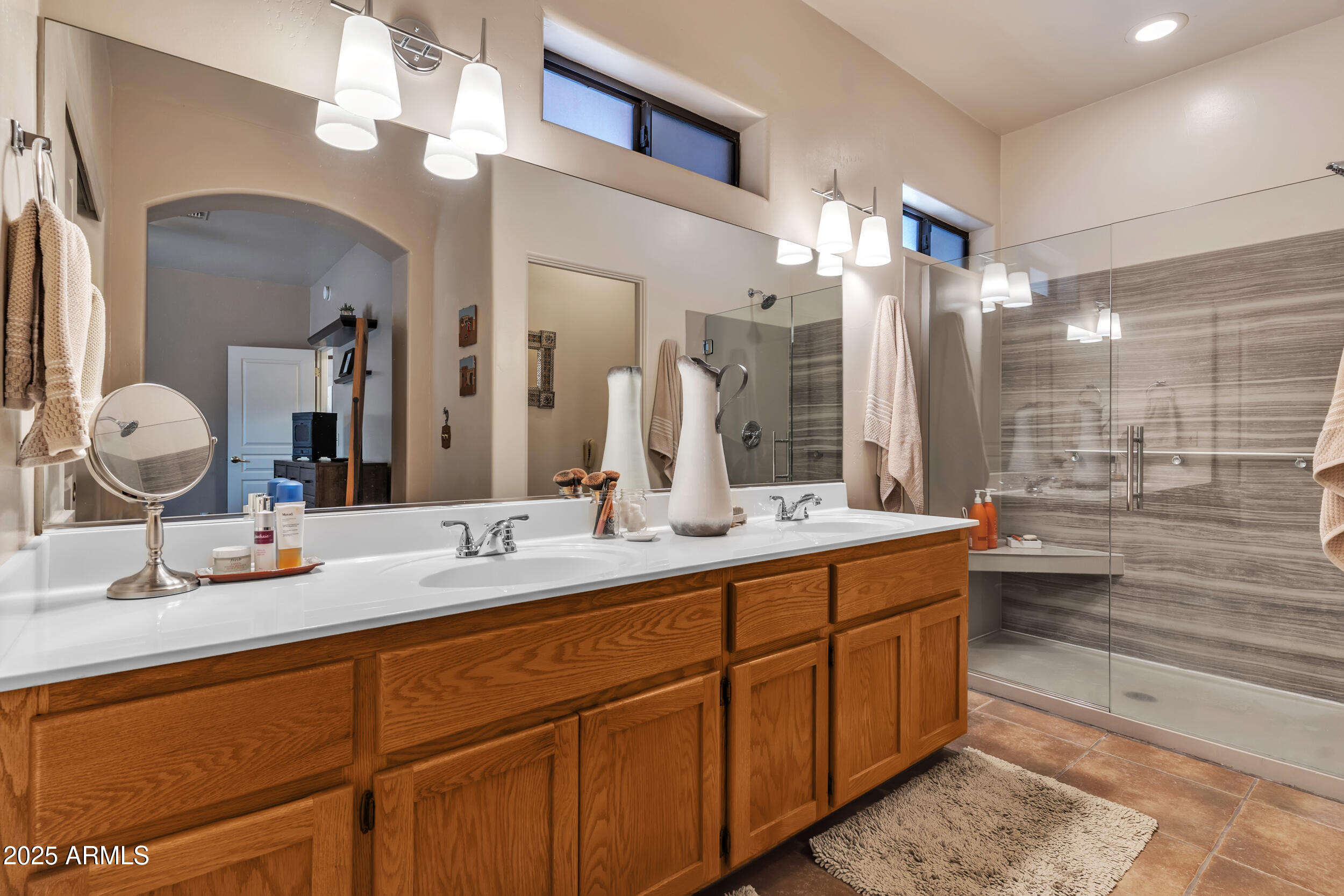613 South Val Vista Road Apache Junction, AZ 85119 - Photo 17 of 31 a bathroom with a double vanity sink mirror double and shower