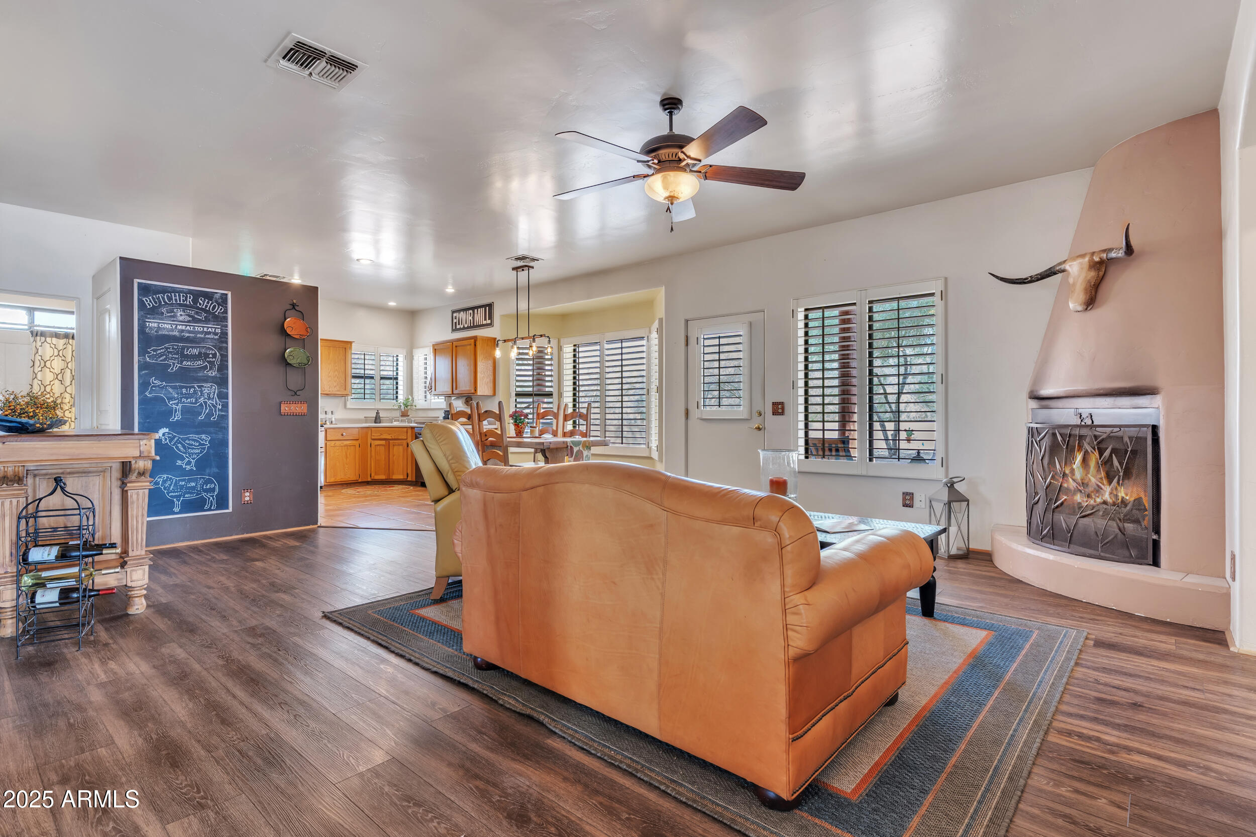 613 South Val Vista Road Apache Junction, AZ 85119 - Photo 8 of 31 a living room with furniture and wooden floor