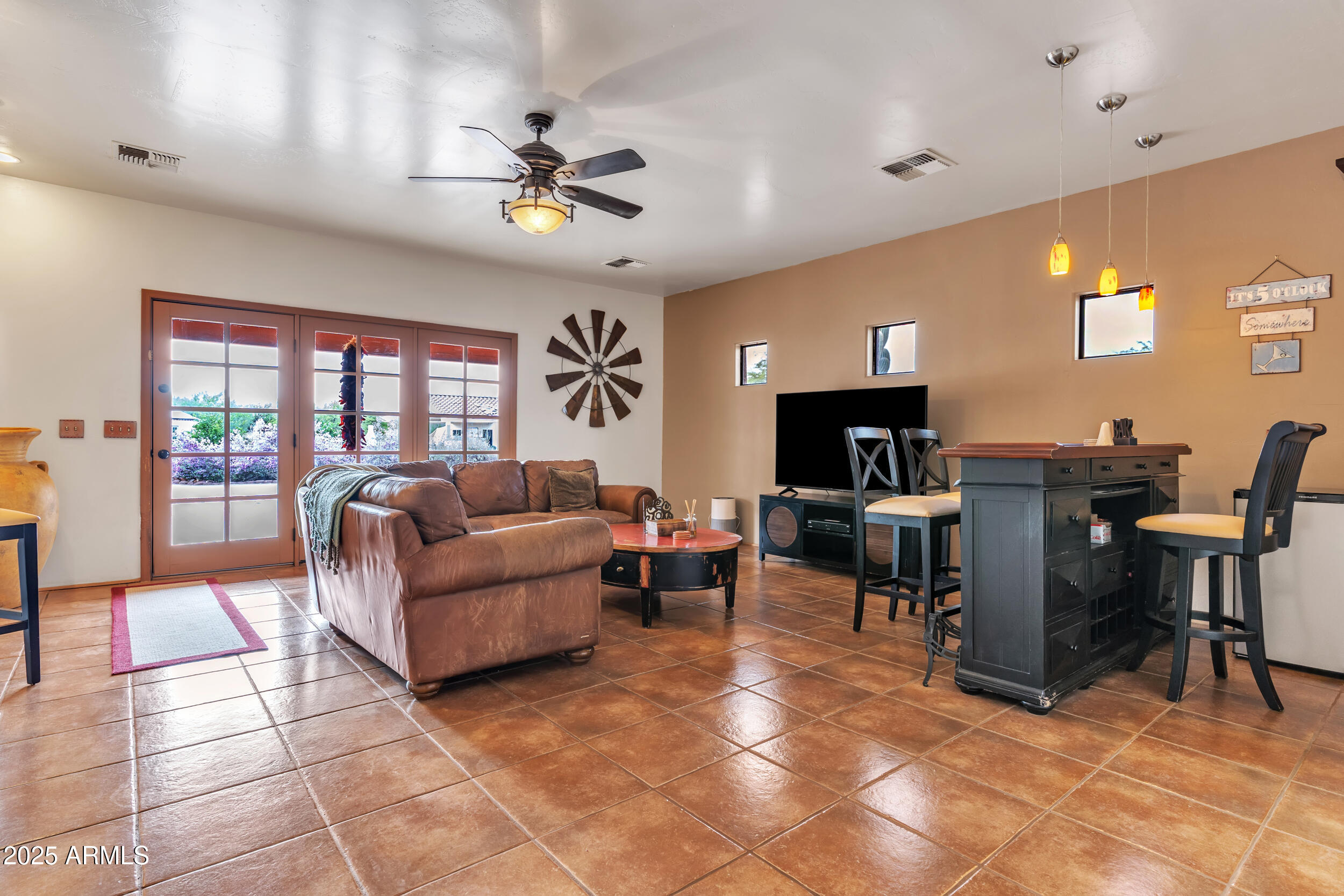 613 South Val Vista Road Apache Junction, AZ 85119 - Photo 9 of 31 a living room with furniture and a flat screen tv