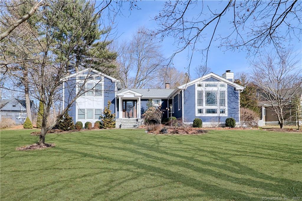 80 Saddleview Road Fairfield, CT 06825 - Photo 1 of 1 a front view of a building with a garden
