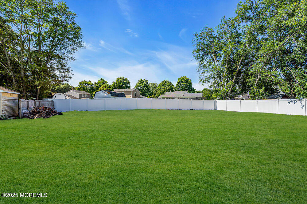 41 Sweetbriar Trail Howell, NJ 07731 - Photo 11 of 11 a view of yard with green space and trees in the background