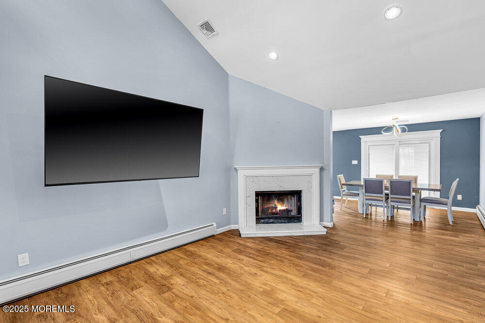 41 Sweetbriar Trail Howell, NJ 07731 - Photo 3 of 11 a living room with furniture and a fireplace